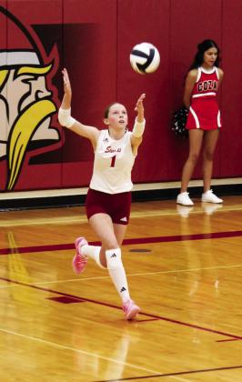 Lauren Mroczek takes her turn at the service line for the Lady Swedes against Cozad last week.