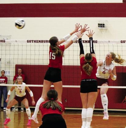 Greer Tiller (#6) gets a kill for the Lady Swedes last Thursday against the Haymakers while teammate Lily Fritton (#8) stands ready to field a potential block.