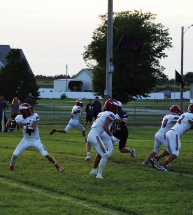 Brady quarterback Cinch Sanger looks downfield for an open receiver during the Eagles’ 62-0 win over Axtell on Aug. 28. Brady moved to 2-0 with the victory after opening the season with a 57-0 win over Sutherland. (Photo courtesy Brady Public School)