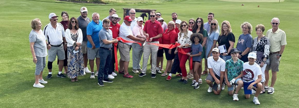 Gothenburg Chamber of Commerce Ambassadors gathered on the new short course at Wild Horse Golf Club on July 1 for a ribbon-cutting and to help celebrate the recently completed additions and renovations. A new expanded dining room, outdoor patio, pro shop, and stay-and-play cabin are just some of the new features besides The Pony. (Photo courtesy Rebecca Jacobsen)