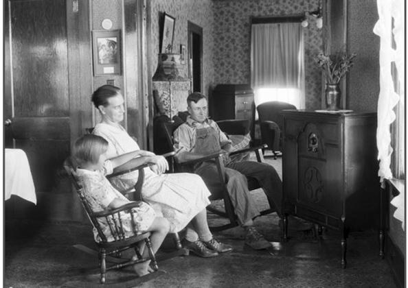 A Midwest farm family listening to the radio in 1930.