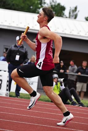 Callen Johnson runs his leg of the men’s 4x400 relay at the state track meet, where the team finished with the fourth-place medal. (Photos courtesy Donna Wiedeburg)