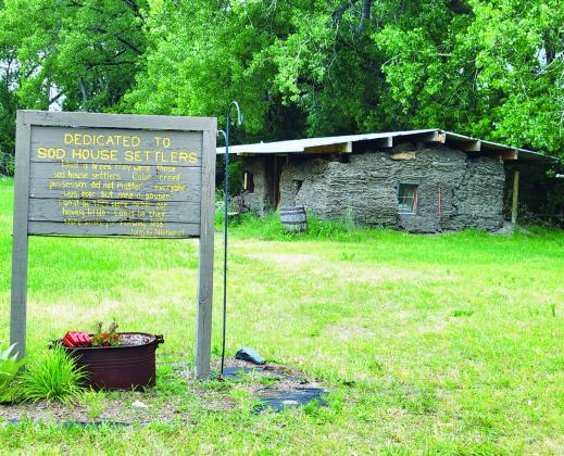 The Sod House Museum in Gothenburg averages about 12,000 visitors each year, not counting those who don’t actually go inside and sign the book. The leaking roof on the soddies has been recently replaced and co-owner J.C. Smith hopes to have the cactus back on the roof soon. (Leader photo by Ellen Mortensen)