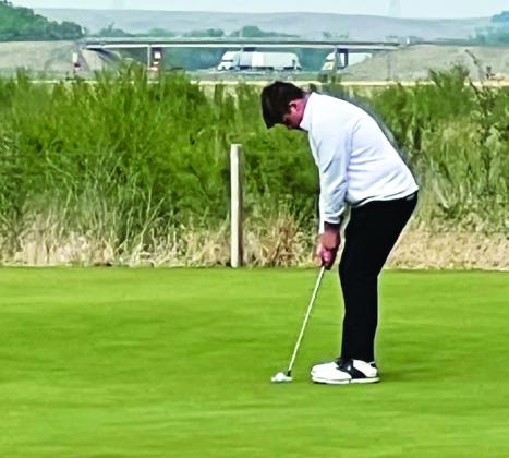 Valon Pfeifer concentrates on a putt during the C-5 District Golf Meet in Ogallala last week, where he earned the silver medal.