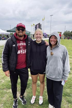 LEFT: Senior Halsey Thomalla was all smiles after winning the 7th place state medal in shot put last week, as she poses with Coach Bryson Mahlberg and best friend Ruby Bell. (Photo courtesy Adrienne Thomalla) BELOW: Jax Rickertsen ended his Swede athletic career with a gold medal at the NSAA State Track Meet last week. (Photo courtesy preprunningnerd)