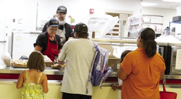 The lunchroom staff had a practice run Monday evening as they served a free supper to those attending the open house.
