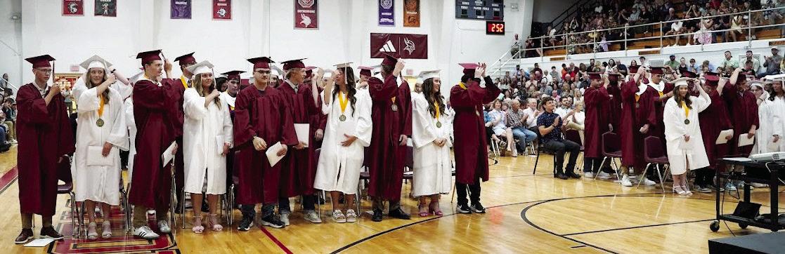 ABOVE: One of the final acts performed together as a class is the traditional moving of the tassel from the left side of the graduation cap to the right. BELOW: From left: Rileigh McClay, Kaitlyn Hecox, and Lindly Anderson delivered the senior address. (Leader photos by Charity Wyatt)