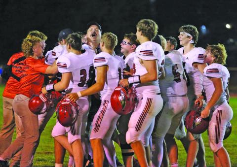The Brady Eagles gather on the field in celebration at the conclusion of their Sept. 24 game at Mullen. Brady earned its fifth straight victory with a 54-30 win over the Broncos.