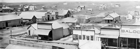 ABOVE: This photo shows what the town of Gothenburg looked like in 1888, around the time Zion Evangelical Lutheran Church and cemetery north of town were established. (Photo courtesy Gothenburg Historical Society) BELOW: The tallest grave marker in Zion Lutheran Cemetery marks the final resting place of Pastor W. Albertson, who died in 1897 after serving the congregation for only two years. (Leader photo by Ellen Mortensen)