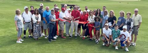 Gothenburg Chamber of Commerce Ambassadors gathered on the new short course at Wild Horse Golf Club on July 1 for a ribbon-cutting and to help celebrate the recently completed additions and renovations. A new expanded dining room, outdoor patio, pro shop, and stay-and-play cabin are just some of the new features besides The Pony. (Photo courtesy Rebecca Jacobsen)