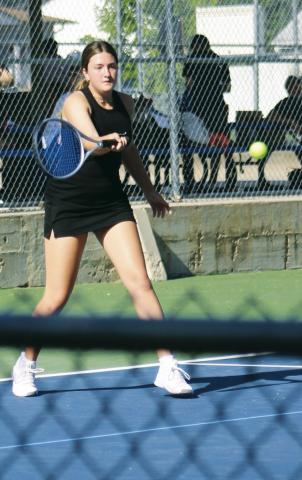 Gothenburg’s Teegan Stevens returns the ball in her match against Campbell Dunham of Kearney Catholic last week.