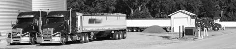 A fleet of semi trucks that once hauled for Gothenburg’s NSG facility now sit motionless after the company made the decision to move away from its over-the-road system. (Leader photo by Ellen Mortensen)