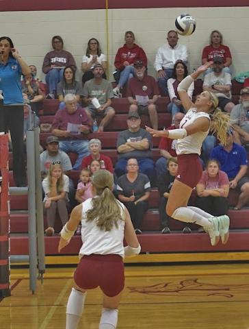 Zoe Beveridge (#2) flies to the top of the net to get the ball over for a kill. She finished with an impressive 21 kills against Amherst on Sept. 22, and helped lead the Swedes to a successful week. (Leader file photos by Charity Wyatt)