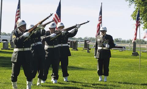 Members of the Gothenburg American Legion Honor Guard presented the gun salute during the Monday program at the cemetery. (Leader photo and story by Ellen Mortensen)