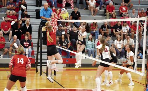 Kenlee Fattig and Ava Foster team up at the net to contest an opposing attack. (Photo courtesy Brady Public School)
