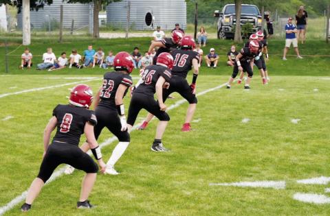 The Brady Eagles prepare to cover the kickoff during their season- opening game against Sutherland.