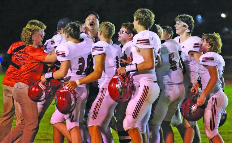 The Brady Eagles gather on the field in celebration at the conclusion of their Sept. 24 game at Mullen. Brady earned its fifth straight victory with a 54-30 win over the Broncos.