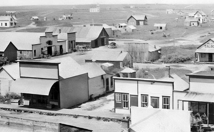 ABOVE: This photo shows what the town of Gothenburg looked like in 1888, around the time Zion Evangelical Lutheran Church and cemetery north of town were established. (Photo courtesy Gothenburg Historical Society) BELOW: The tallest grave marker in Zion Lutheran Cemetery marks the final resting place of Pastor W. Albertson, who died in 1897 after serving the congregation for only two years. (Leader photo by Ellen Mortensen)
