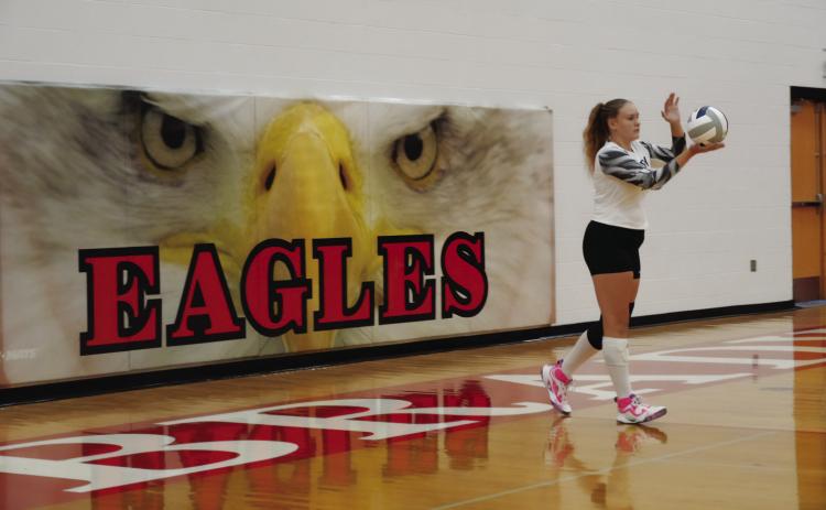 Freshman Tailynn Stearns prepares to serve during the Eagles’ home match against Wauneta-Palisade on Sept. 4. (Photo courtesy Brady Public Schools)