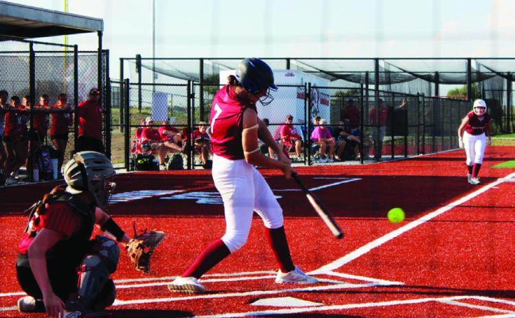 Taye Herrick gets a single to drive in Brittlin Bussinger from third for a Swede score. (Leader photos by Megan Aden)