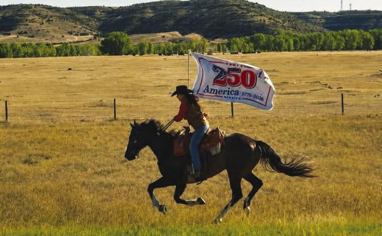 The Pony Express Re-Ride promoted America’s 250th birthday all across the trail, as shown by this rider in her leg of the journey across Wyoming. (Photo courtesy National Pony Express)