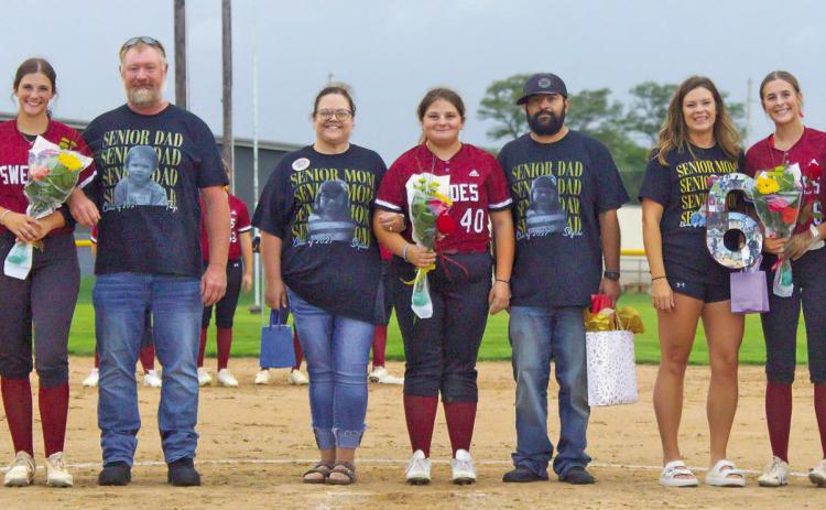 The senior Swede softball players and their parents were recognized on Sept. 15. Pictured from left are: Taye Herrick with parents Arlie Maurer and John Herrick; Skylar Garza and her parents David and Ashley Garza; and Aubrey Cross with her parents Jessica and Henry Cross. (Leader photos by Megan Aden)