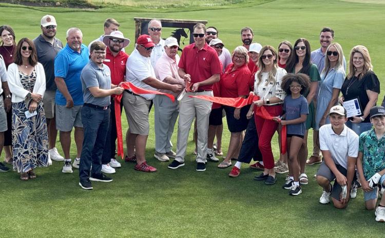 Gothenburg Chamber of Commerce Ambassadors gathered on the new short course at Wild Horse Golf Club on July 1 for a ribbon-cutting and to help celebrate the recently completed additions and renovations. A new expanded dining room, outdoor patio, pro shop, and stay-and-play cabin are just some of the new features besides The Pony. (Photo courtesy Rebecca Jacobsen)