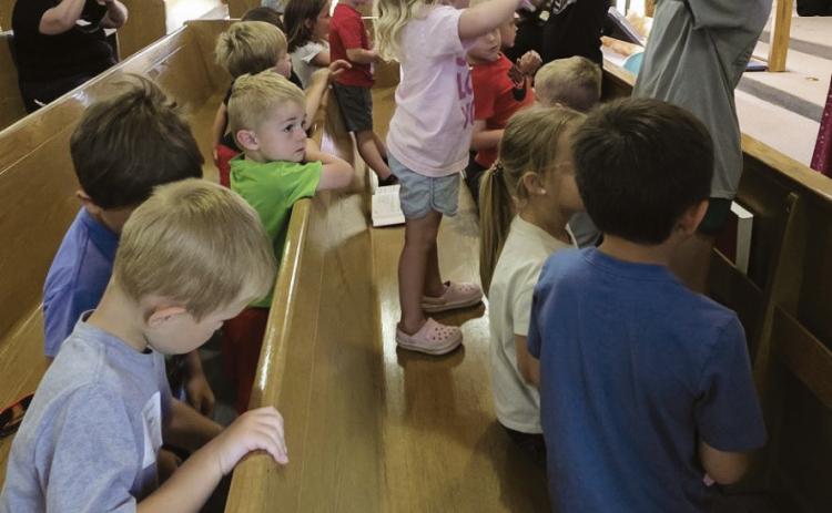 Zion Lutheran Church is hosting Vacation Bible School this week with 50 kids registered. Though the building has sold, the congregation continues to meet every Sunday for worship service and holds fun events like the annual summertime VBS. (Leader photo by Leta Connell) THIS SPACE LEFT BLANK FOR MAILING LABEL