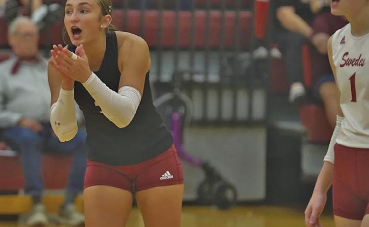 One of the jobs of the libero is team leader, and here senior Ellaray Koch works to fire up her team with teammate Lauren Mroczek by her side.