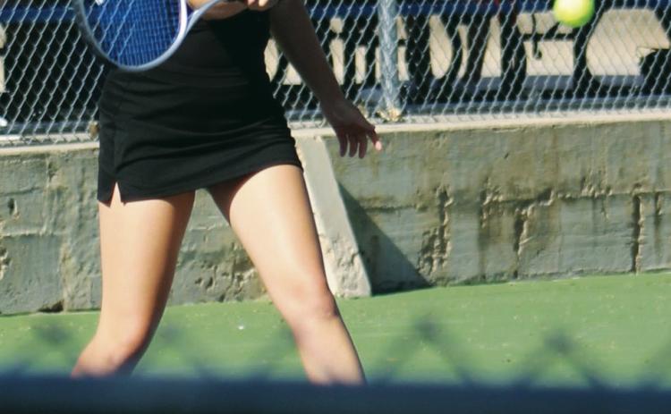 Gothenburg’s Teegan Stevens returns the ball in her match against Campbell Dunham of Kearney Catholic last week.
