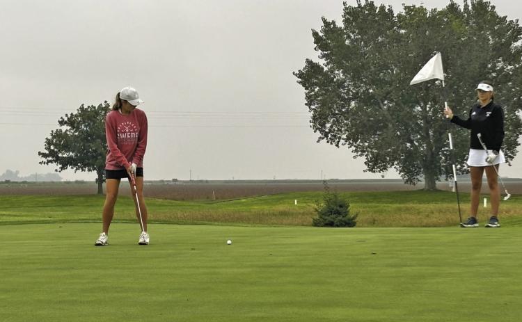 Lily Sics squares up for a putt during the SWC meet in Cozad on Sept. 28. She shot the best round of her career at the meet, earning the 12th-place medal. (Photos courtesy Tara Foster)