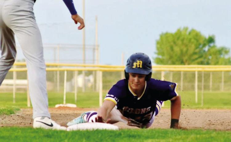 William McVay slides into the base during a close play against Minden on June 19. (Photos courtesy Shiloh Schultz)