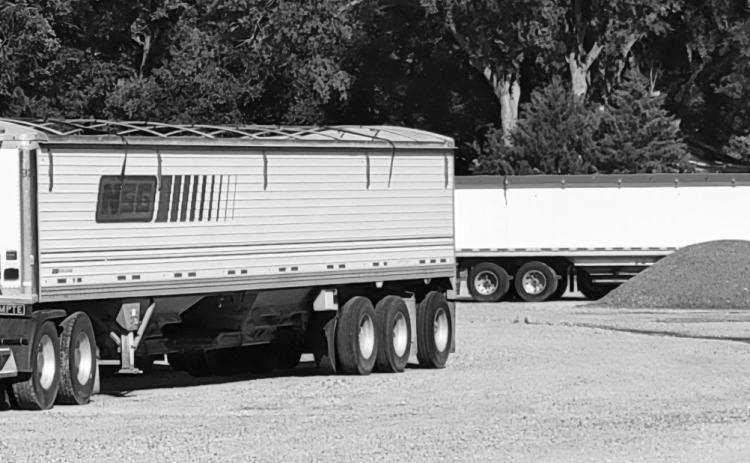 A fleet of semi trucks that once hauled for Gothenburg’s NSG facility now sit motionless after the company made the decision to move away from its over-the-road system. (Leader photo by Ellen Mortensen)