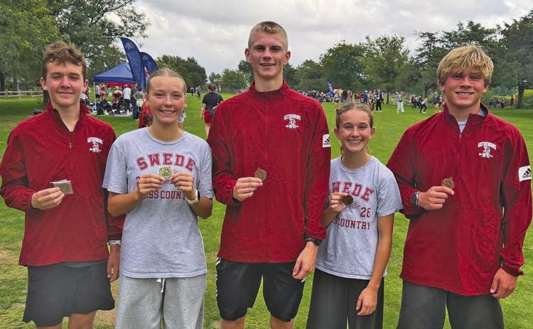 Winning medals at the UNK Invite last week for the Swede cross country team were, from left: Blake Finke, Scout Bell, Bryson Neels, Cassidy Reiman, and Tyler Hetz. The team is back on the course today, Oct. 8, at the SWC meet in Cozad. (Photo courtesy GPS)