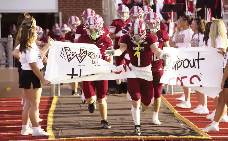 Senior Jaxon Earll leads the Swedes onto the field for last week’s game against Mitchell. Gothenburg improved its record to 3-0 with a 45-29 win. (Leader photos by Charity Wyatt)