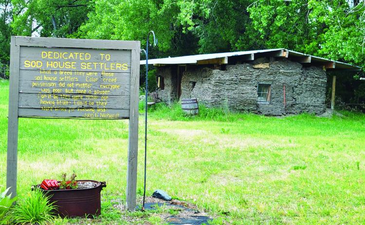 The Sod House Museum in Gothenburg averages about 12,000 visitors each year, not counting those who don’t actually go inside and sign the book. The leaking roof on the soddies has been recently replaced and co-owner J.C. Smith hopes to have the cactus back on the roof soon. (Leader photo by Ellen Mortensen)