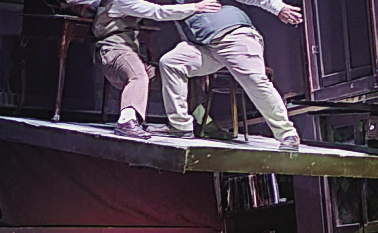 While it may look as though this is a stage malfunction, which it was in the play being portrayed, actors Carter Kincheloe and Jesse Kincheloe were perfectly safe in this scene...well, almost.