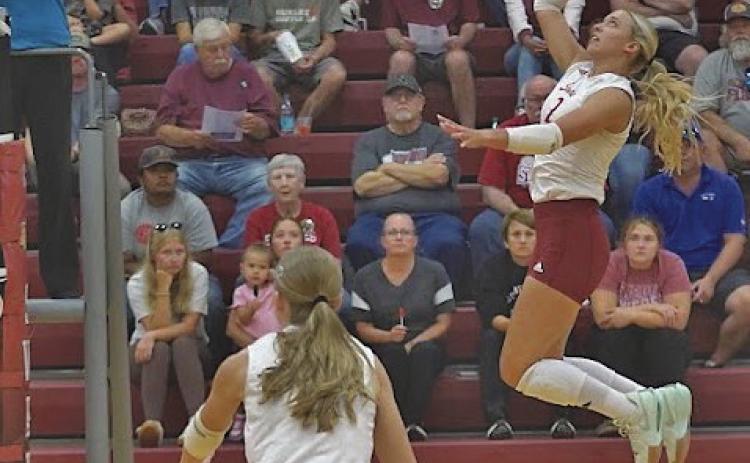 Zoe Beveridge (#2) flies to the top of the net to get the ball over for a kill. She finished with an impressive 21 kills against Amherst on Sept. 22, and helped lead the Swedes to a successful week. (Leader file photos by Charity Wyatt)