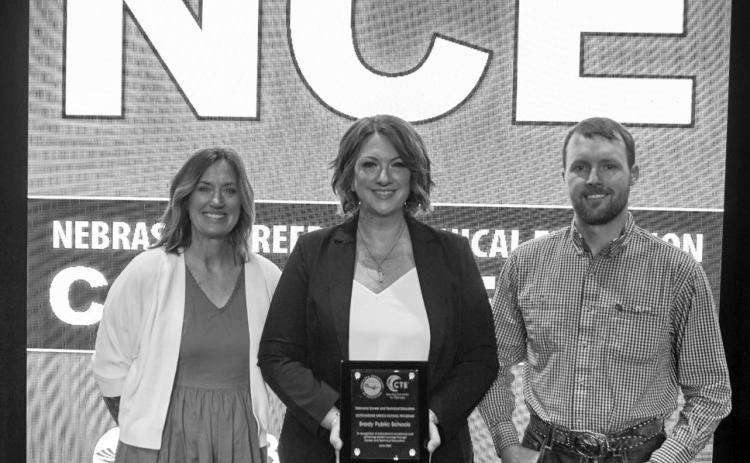Superintendent Ann Foster (center) was joined by JAG teacher Sharon Axthelm and Agriculture Instructor Trevor Mann in accepting the 2026 award for Nebraska’s Outstanding Middle School CTE program on June 9. The school board celebrated the award at their recent meeting. (Photo courtesy BPS)