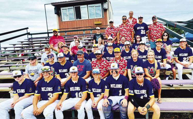 The parents of the Gothenburg Junior Melons baseball team continued to show their support throughout the season, demonstrated here with their theme-based attire during the area tournament. (Photo courtesy Shiloh Schultz)