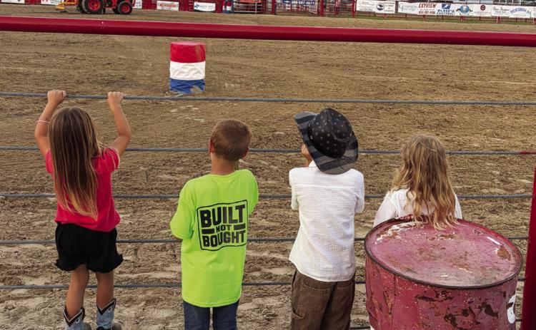 The rodeo is exciting to watch for spectators of all ages. These kids got as close to the action last Friday night as they could!