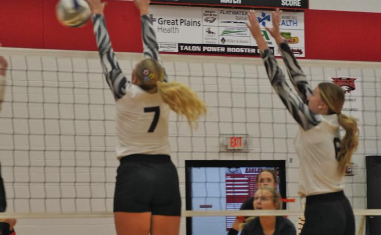 Brady’s Kenlee Fattig and Ava Foster go up for a block during the Eagles’ Oct. 2 home match against Maxwell. Brady earned a 3-2 victory in a five-set battle. (Photo courtesy of Brady Public Schools)