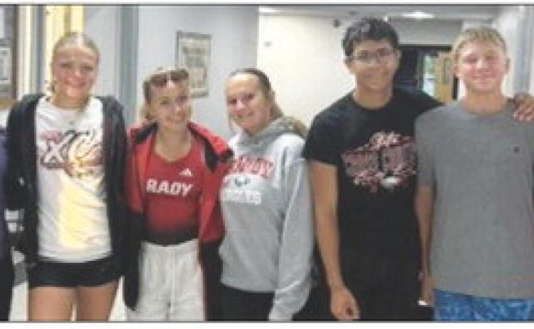 Members of the Brady cross country team gather before heading to the Cozad Invite on Sept. 3. The Eagles turned in a strong day on the course, highlighted by several medal finishes and new personal records. (Photo courtesy Brady Public Schools)