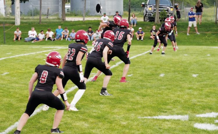 The Brady Eagles prepare to cover the kickoff during their season- opening game against Sutherland.